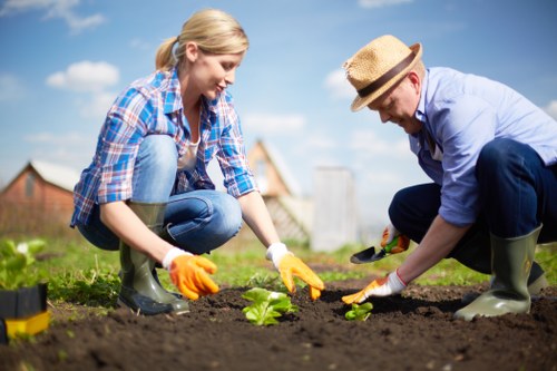 Worker using a protective mask while handling garden chemicals